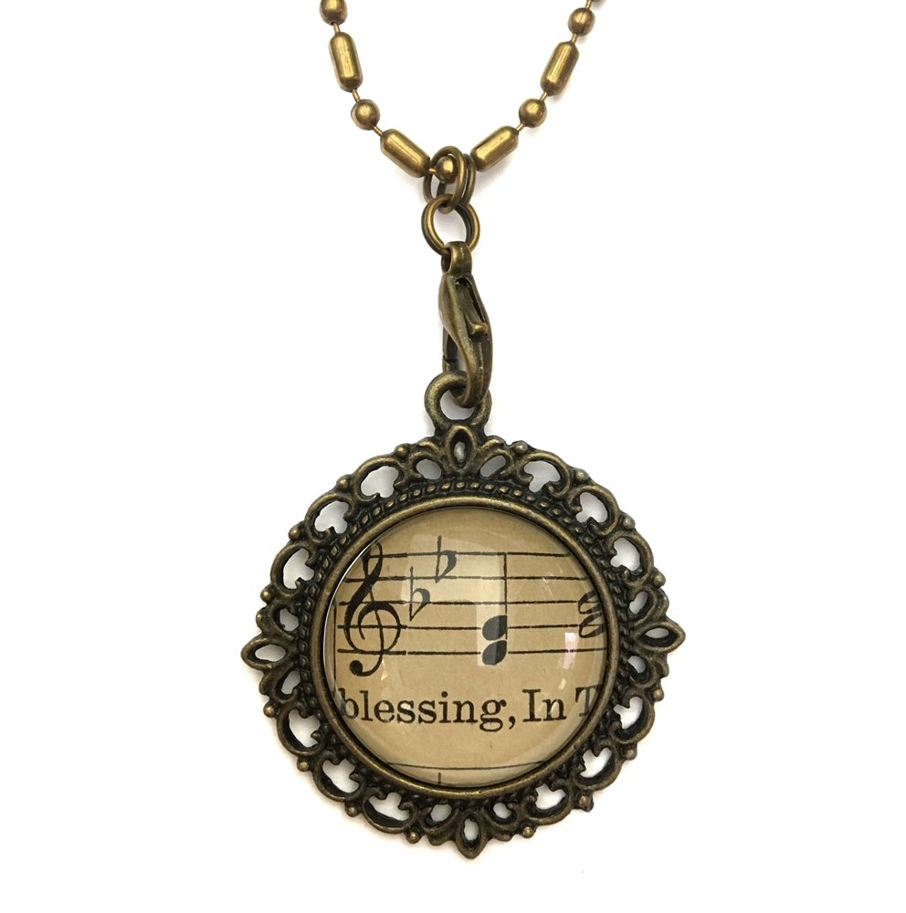 handmade real sheet music form the 1800's vintage necklace sealed under glass cabachon necklace Anthologie