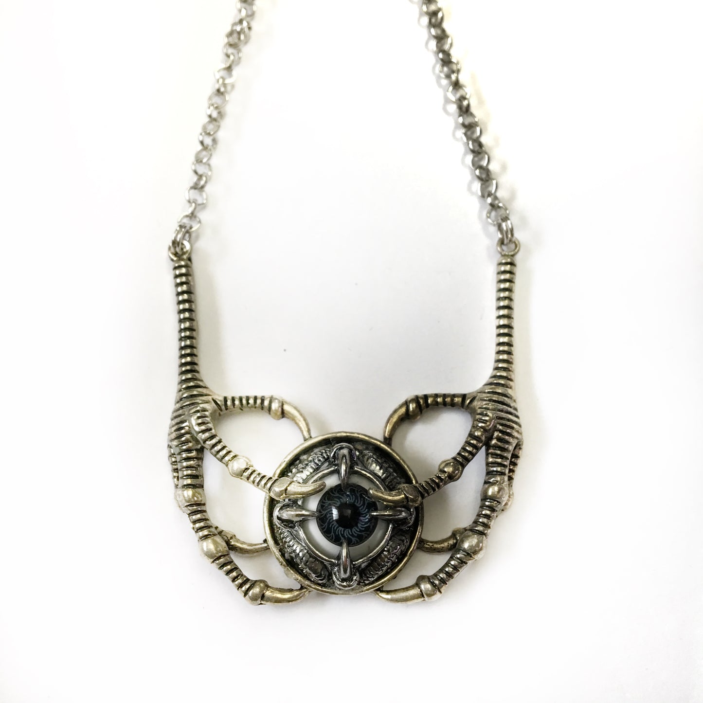 claw holding an eye choker necklace dragon feel