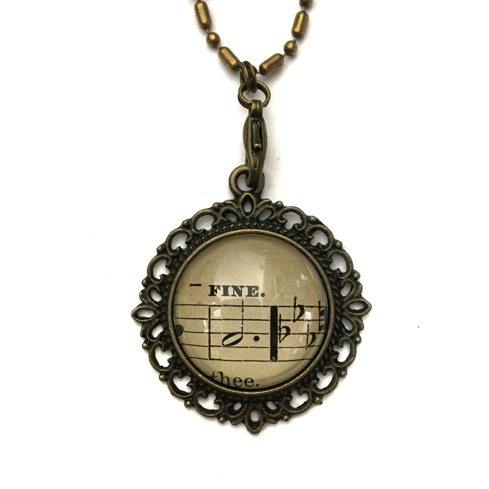 handmade real sheet music form the 1800's vintage necklace sealed under glass cabachon necklace Anthologie