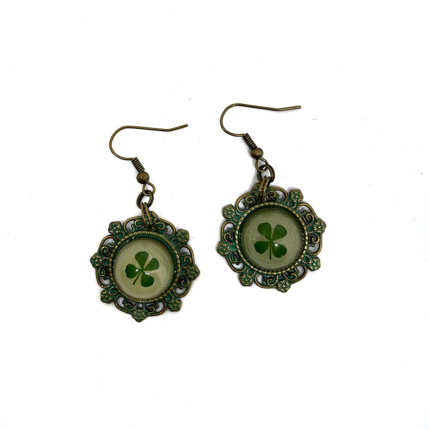 patine 4 four leaf clover dangle earrings that glow