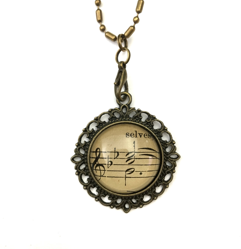handmade real sheet music form the 1800's vintage necklace sealed under glass cabachon necklace Anthologie