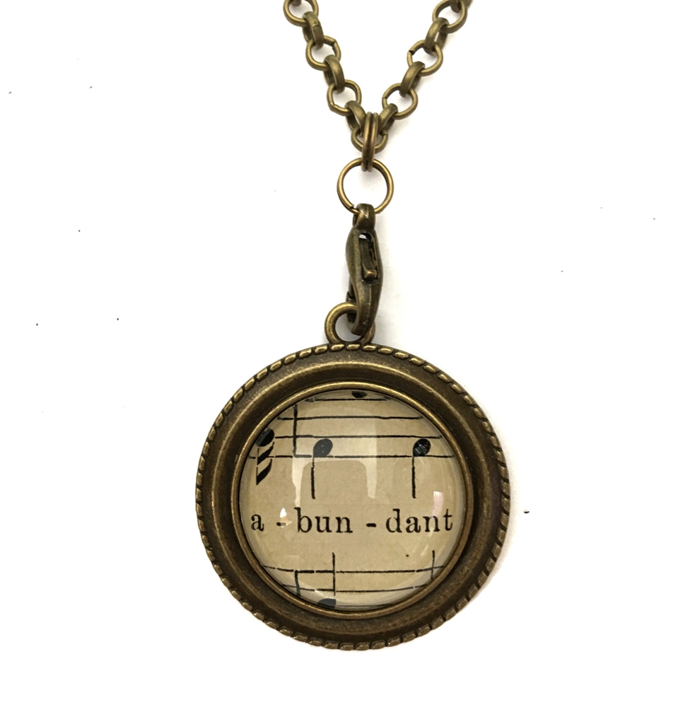 handmade real sheet music form the 1800's vintage necklace sealed under glass cabachon necklace Anthologie