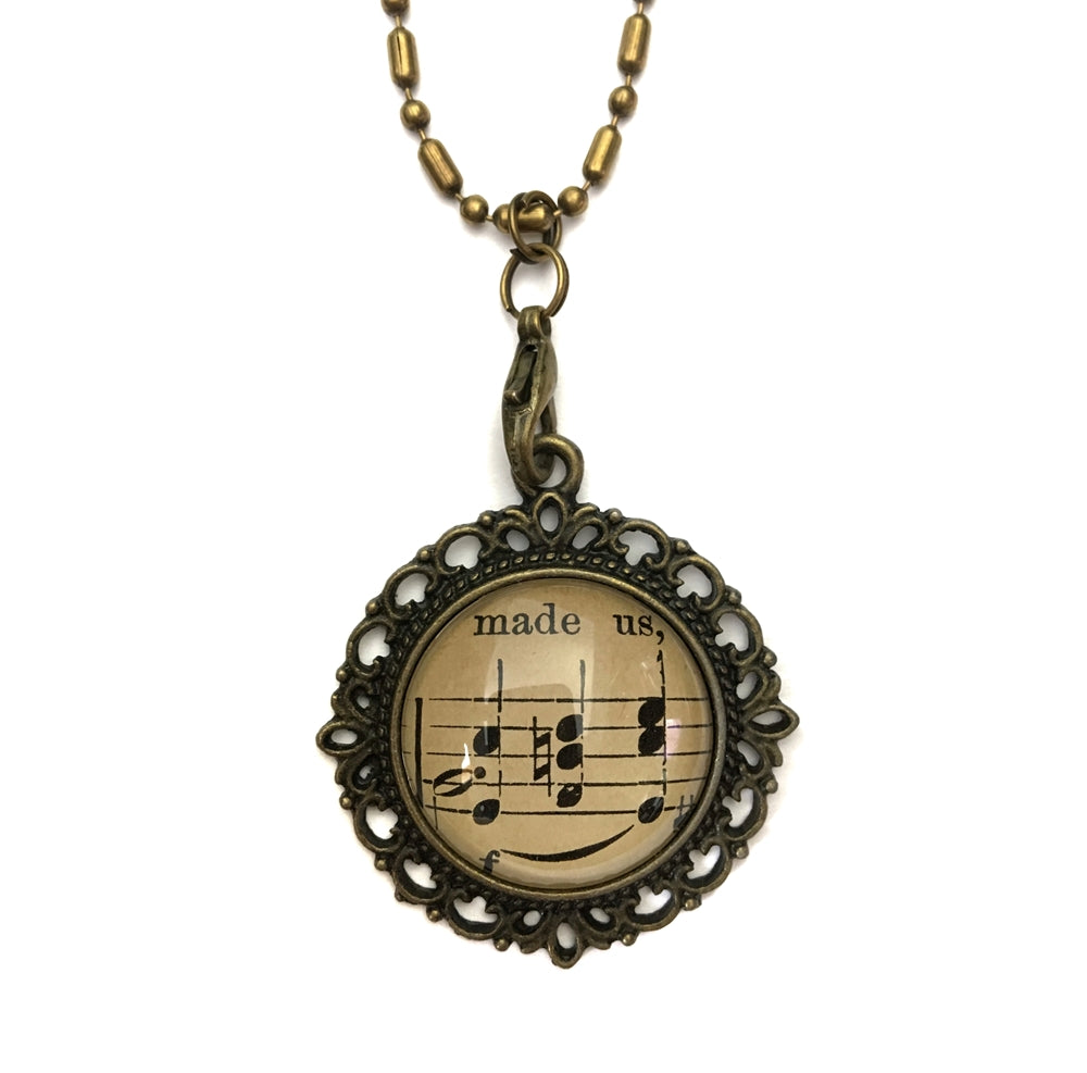 handmade real sheet music form the 1800's vintage necklace sealed under glass cabachon necklace Anthologie