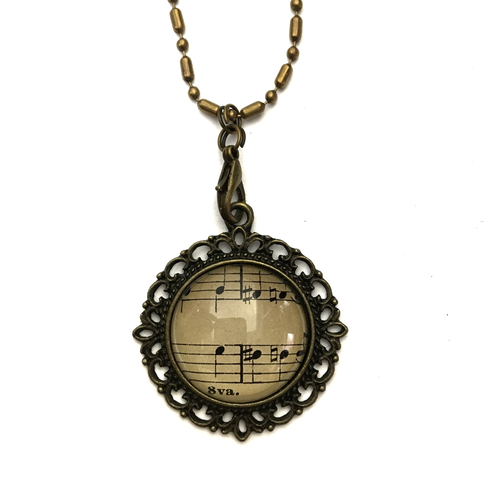 handmade real sheet music form the 1800's vintage necklace sealed under glass cabachon necklace Anthologie