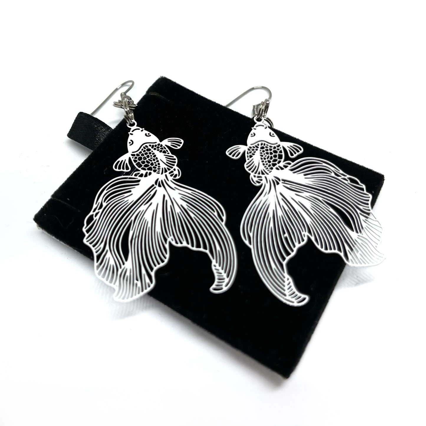 lightweight white dangle koy earrings