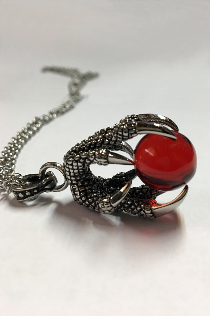 red ball in a dragon claw necklace