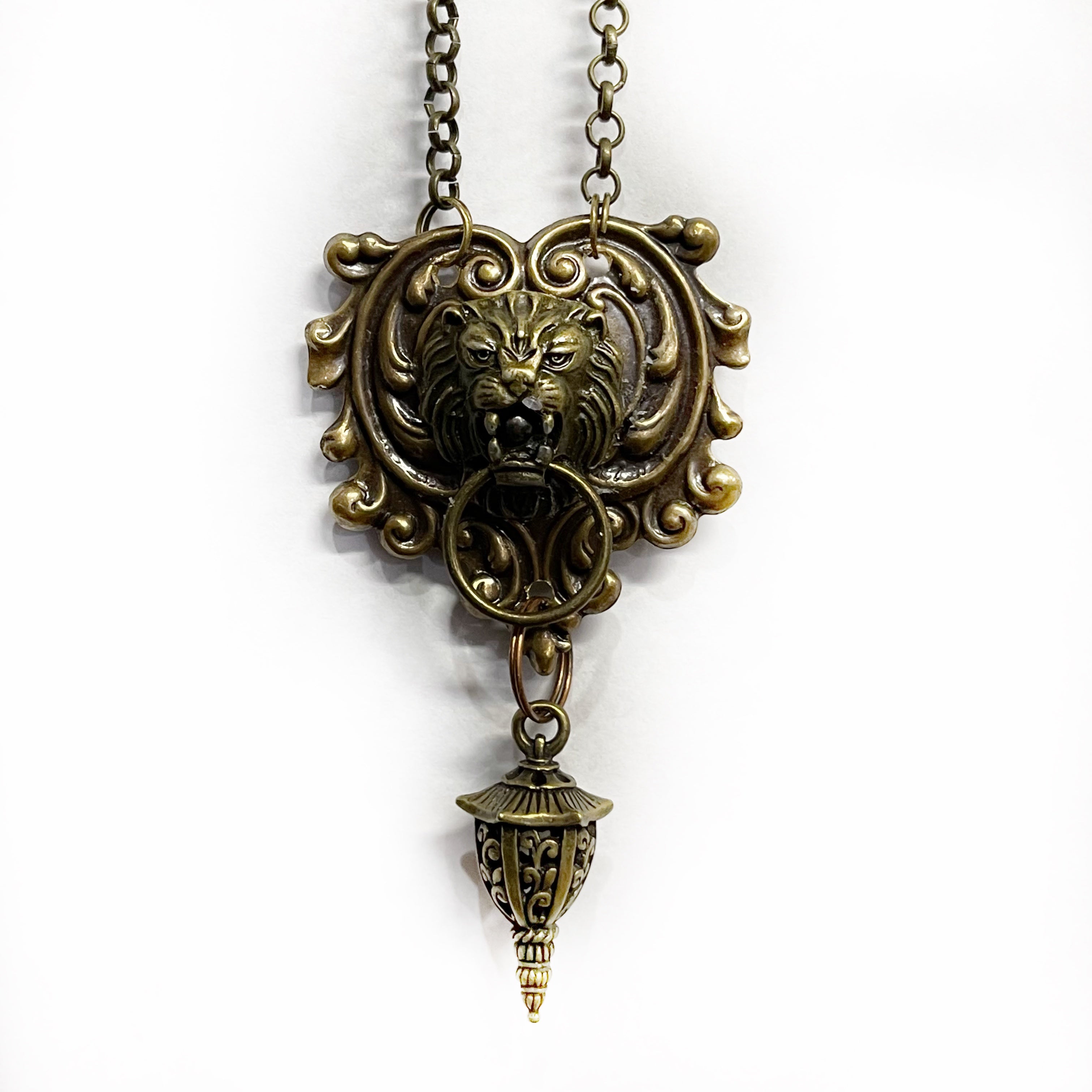 lion doorknocker necklace in bronze with hanging lantern charm vintage