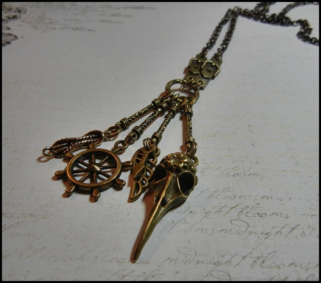 raven necklace with ships wheel wing and rope