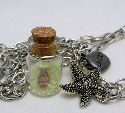 shell in glowing sand necklace with starfish charm