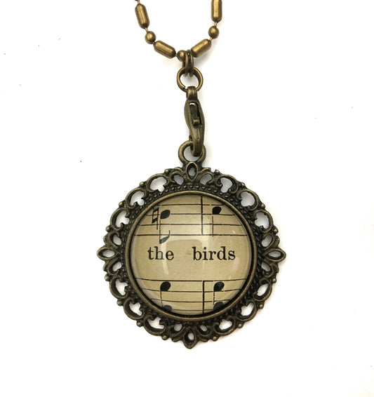 handmade real sheet music form the 1800's vintage necklace sealed under glass cabachon necklace Anthologie