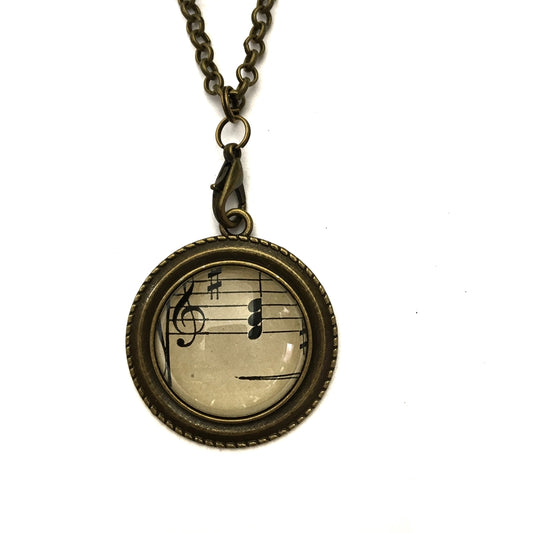 handmade real sheet music form the 1800's vintage necklace sealed under glass cabachon necklace Anthologie